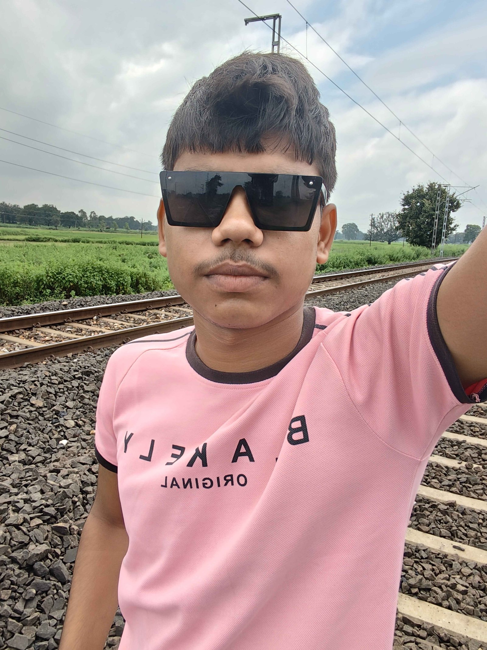 Sanjay Kumar Vaishya railway track selfie with sunglasses photo