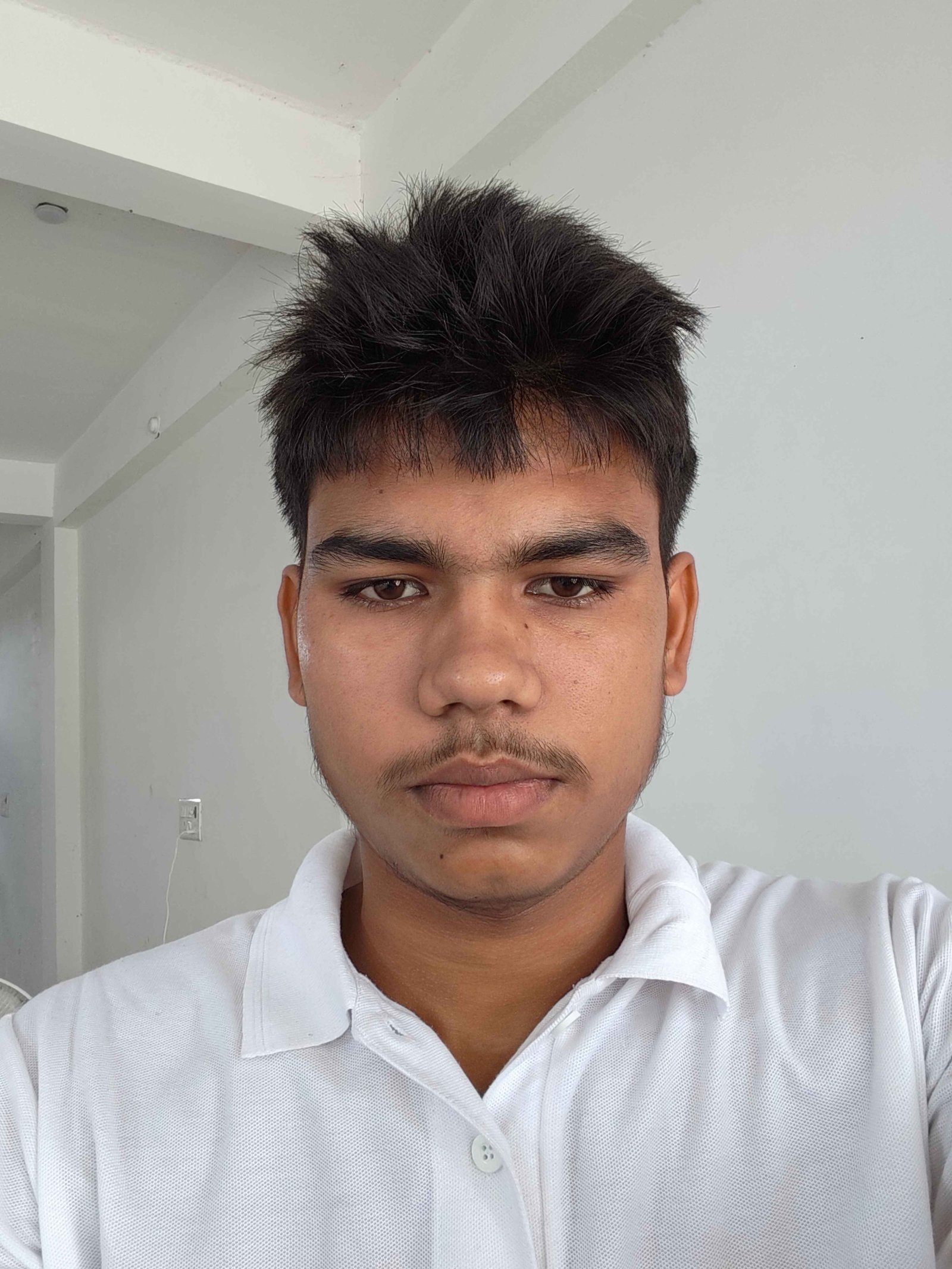 Sanjay Vaishya white shirt indoor portrait photo